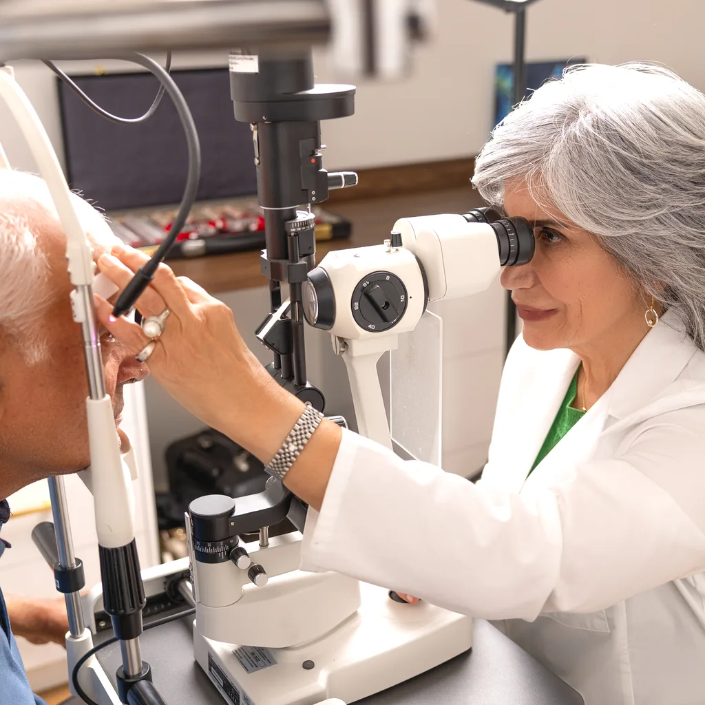 Dr. Roxanna Gangi examining a patient at the slit lamp in her York Region eye clinic